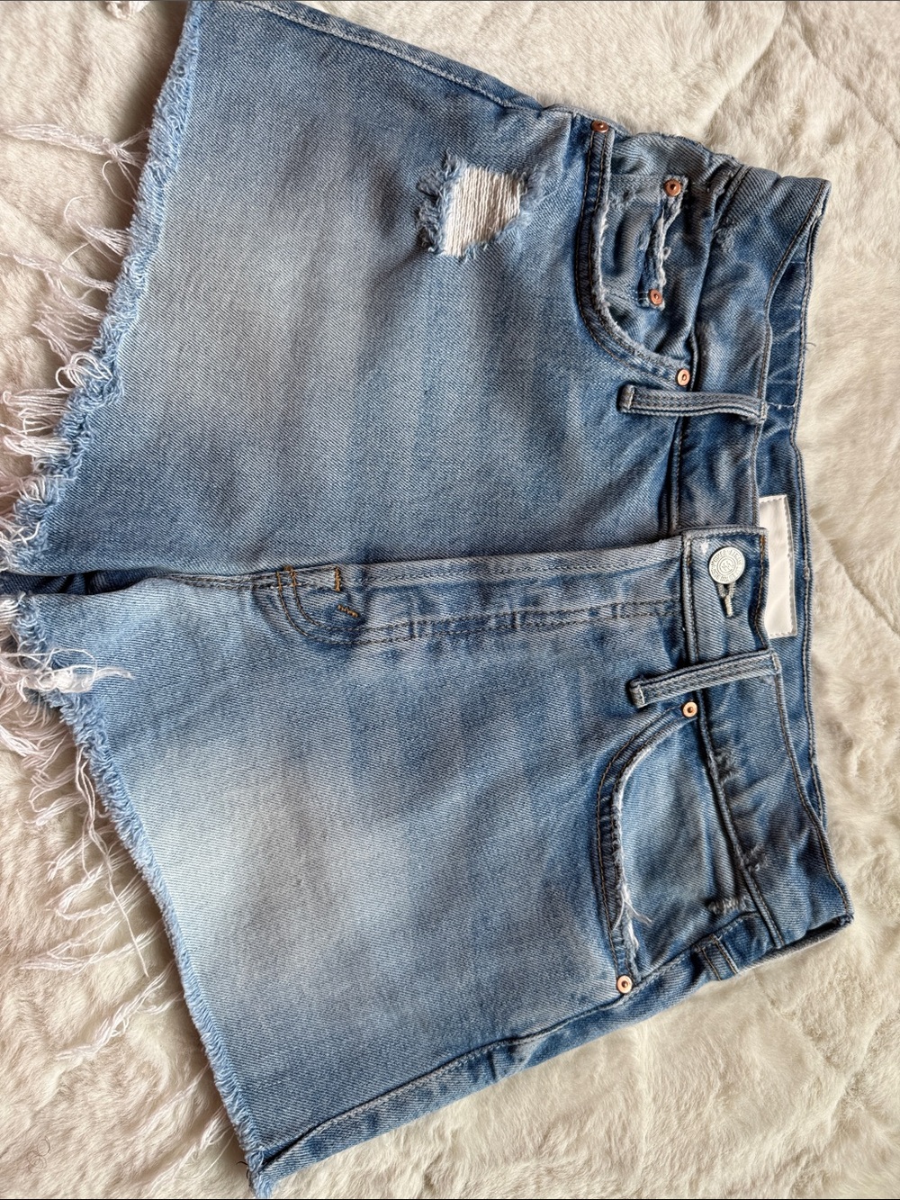 MOTHER Light Wash Denim Cutoff Shorts with Distressed Detail
